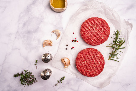 Raw steak burgersの写真素材