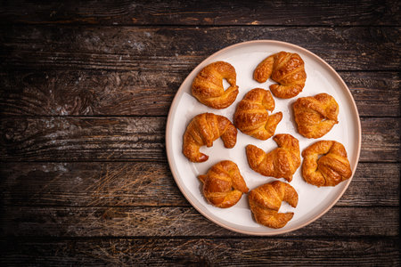 Homemade freshly baked in oven mini croissantsの写真素材