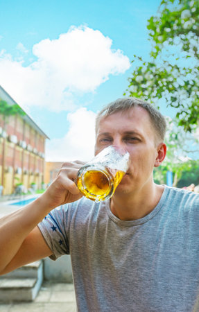 Man is drinking beer