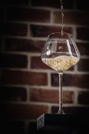 Pouring white wineの写真素材