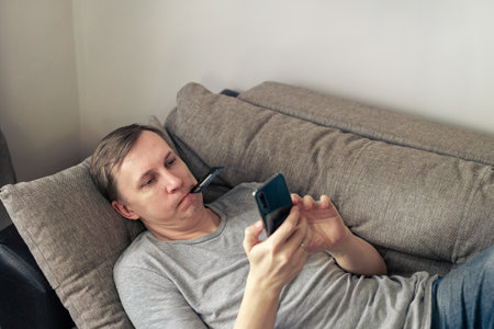 Man holding smartphoneの写真素材