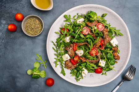 Warm beef meat salad with arugulaの写真素材
