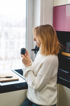 woman enjoying morning coffeeの写真素材