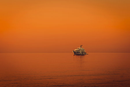 Luxury yacht floats on calm sea