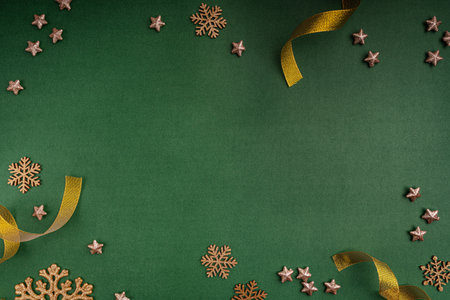 Gold and Green Christmas Ornaments Frame on Green Backgroundの写真素材