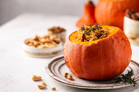 Pumpkin stuffed with riceの写真素材