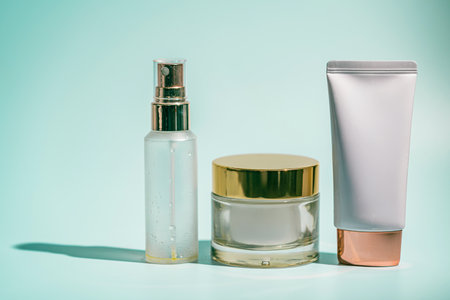Three skincare products on blueの写真素材