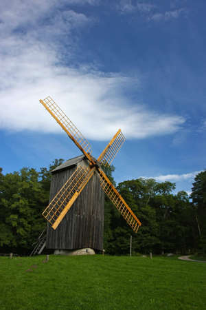 Old example of an alternative energy generation - wooden windmill.の写真素材