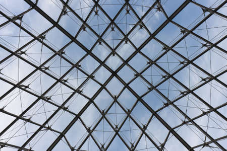 Modern symmetrical transparent glass roof with metal supporting frameの写真素材