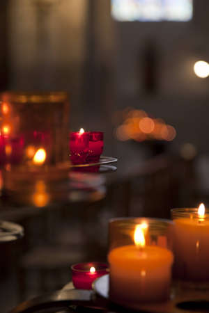 Glass candles glowing in a church. Shallow depth of field.