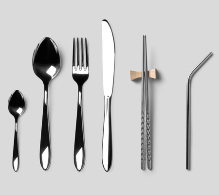 Set of silverware isolated on gray background. Top view. Flat lay.の写真素材