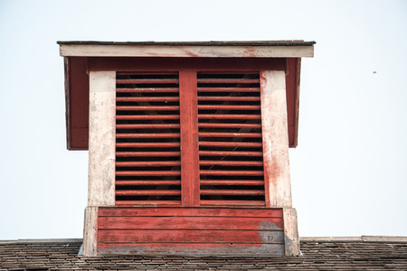 Old red barn with rustic weathered cupola.の写真素材