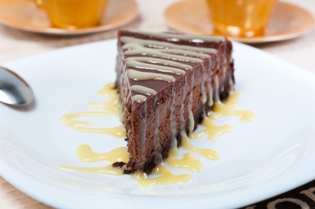 Chocolate cheesecake with white chocolate sauceの写真素材