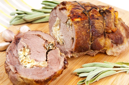 Baked pork meat with onion and sageの写真素材