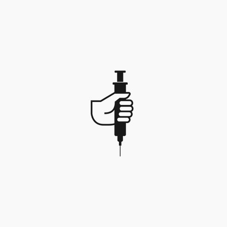 Hand holding syringe icon. Vector illustration. Flat design styleのイラスト素材