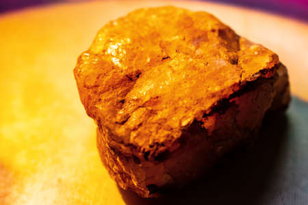gold rock or golden stone is shining on light