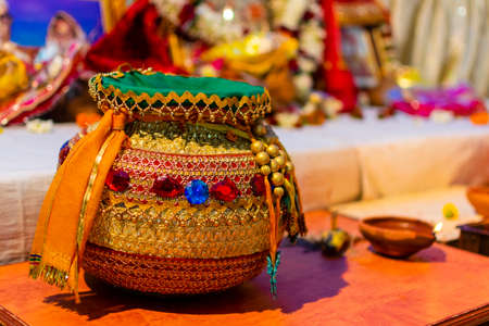 Decorated clay pot with gems and jewels; traditional hindu wedding ceremony ritual toolの写真素材