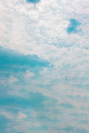 Cumulus cloud formation in the sky after rain, pink, blue, orange colorful twilightの写真素材