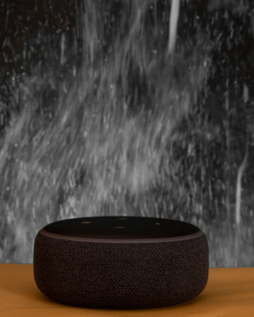 Bankura, West Bengal, India - September 24, 2022: Amazon Echo Dot third Generation with Built-in Alexa Smart Wi-Fi Speaker Black with colorful smoke background studio photography.のeditorial素材