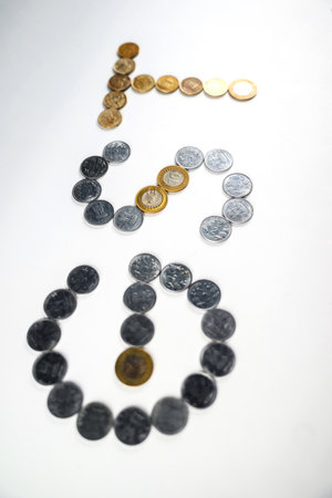 Depiction of monetary coins arranged to form the acronym 'GST,' symbolizing the financial and...