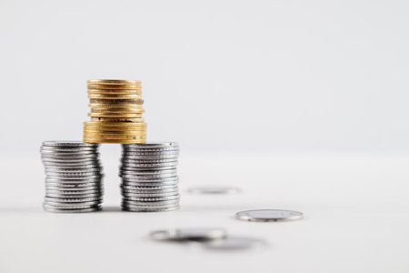 Pile of gold and silver coins showcasing economic growth, investment, and financial stability...