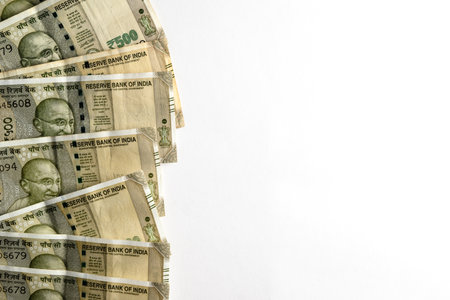 A detailed view of 500 Indian Rupee banknotes arranged on a white surface.の写真素材