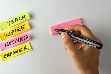 Sticky notes with positive affirmations and action words written, symbolizing motivation,...