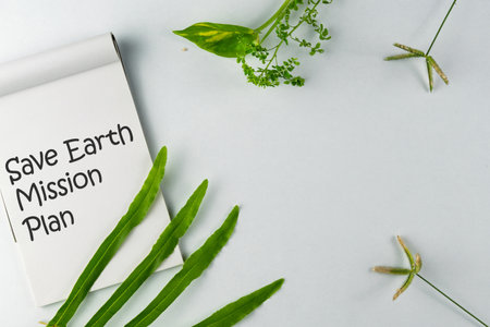 Eco-conscious concept of saving the Earth, featuring a mission plan notebook with green plants....