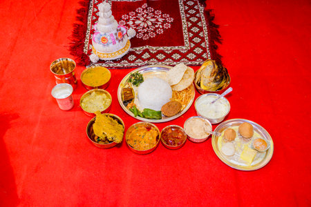 Authentic Indian dishes served on a decorative tray showcasing rich culture and flavors,...