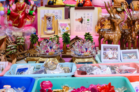 Vibrantly colored handicrafts, decorative items, and souvenirs arranged on a stall. This image showcases intricate craftsmanship capturing the beauty of folk art and culture. Perfect for tourism, tradition, and craft-related themes.の写真素材