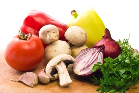 vegetarian mix of mushrooms and healthy vegetables isolated on whiteの写真素材