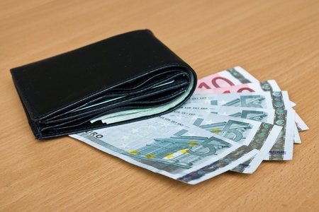 Euro, europe money, banknotes and wallet on the tableの写真素材