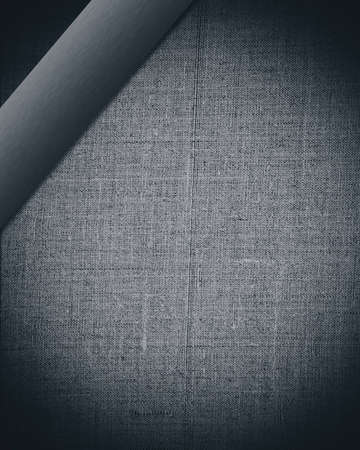 aged black sheet of fabric with dark bar as vintage background for insert text or design の写真素材