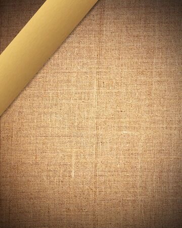 aged brown fabric with gold  bar as vintage background for insert text or design の写真素材