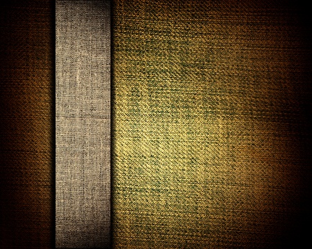 grunge dark yellow fabric with brown bar as vintage background for insert text or designの写真素材