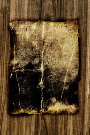 dark old paper on wooden board の写真素材