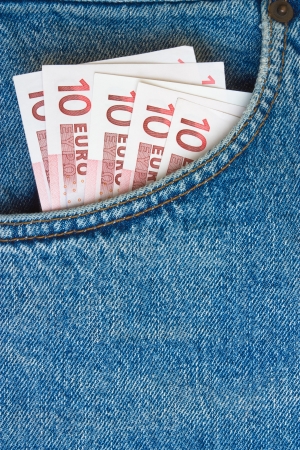 euro banknotes in jeans pocket with blank background for textの写真素材