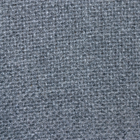 old grey thick fabric texture background, natural wool upholstery closeupの写真素材