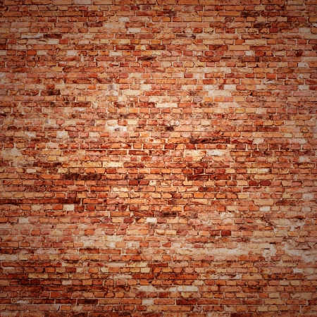red brick wall texture grunge background with vignetted corners of interiorの写真素材