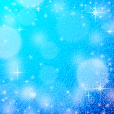 blue christmas background texture with snow flakes, round beams off light and delicate snow patternの写真素材