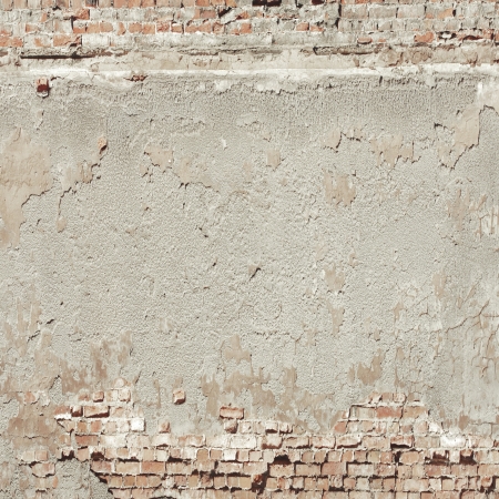 old wall texture background red bricks and cement plasterの写真素材