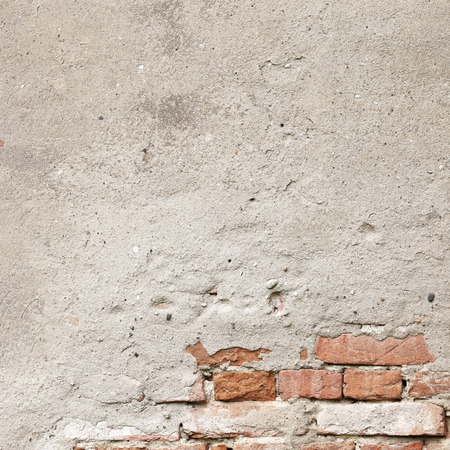 grunge background, wall texture, bright plaster and red bricksの写真素材
