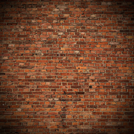 red brick wall texture grunge background with vignetted corners to interior design