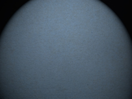 dark blue wall background, old suede paper texture and beam of spot light vignetteの写真素材