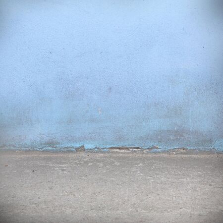 blue wall texture and gray concrete floor grunge backgroundの写真素材