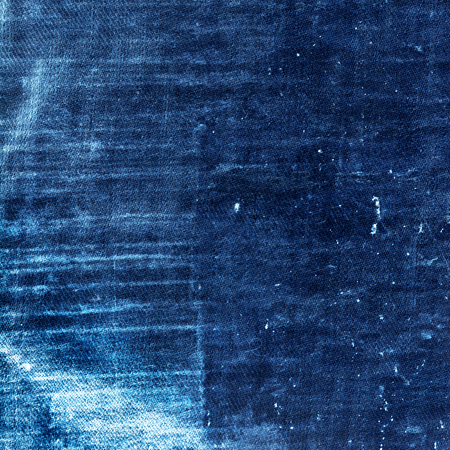 worn jeans texture blue background, destroyed denim fabric textureの写真素材