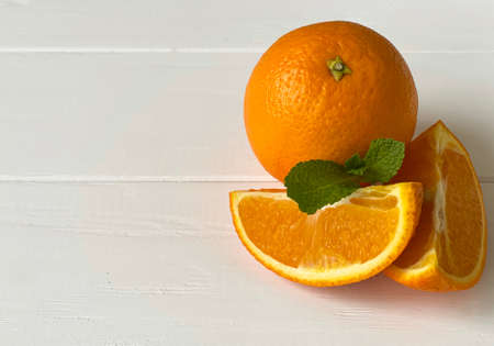 orange and mint on a white table