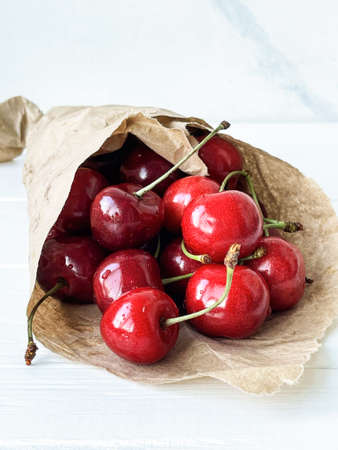 summer cherry berries on a white tableの写真素材