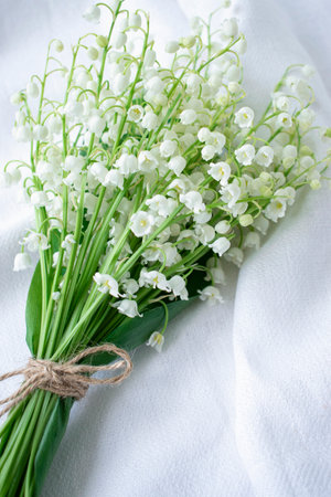 bouquet of lilies of the valley on a napkin on the table