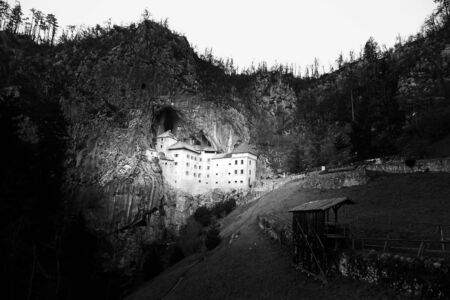 Medieval Predjama Castle near Postojna, Slovenia, Europe, black and white versionのeditorial素材